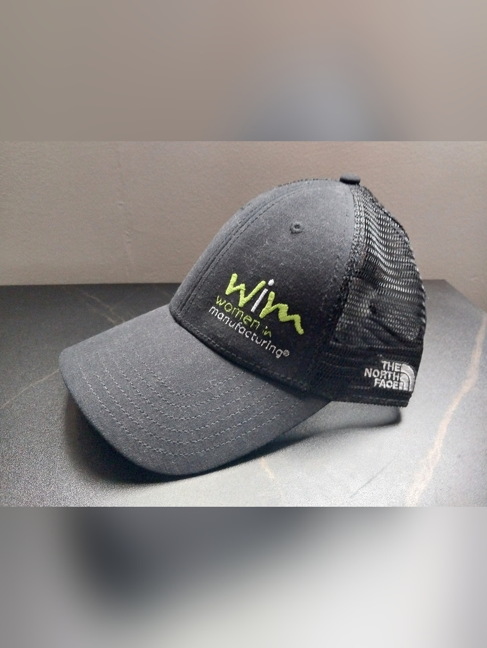 The North Face Black Trucker Hat *women in manufacturing*  Logo